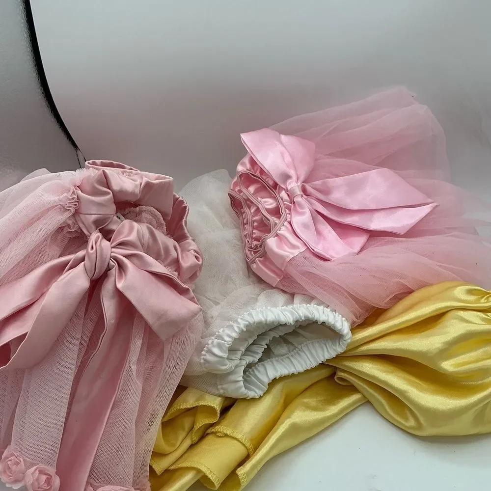 Set of 4 Pink white and Yellow Tutu assorted sizes(2,4,L) but they fit the same